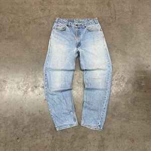 Vintage 90s Levi's 634 orange tab light wash denim jeans with tattered bottoms